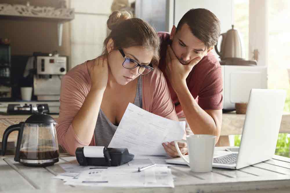 Young couple looking at the Advantages of Solar Panels for Homes