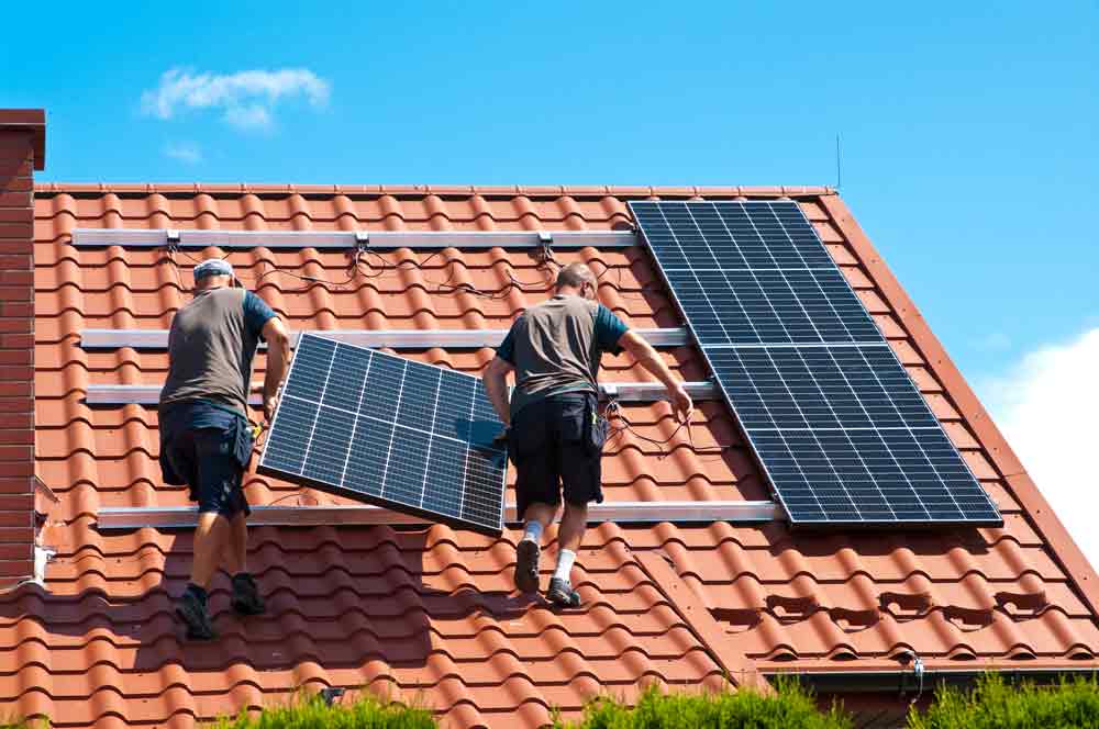 solar panels installers on roof in the UK